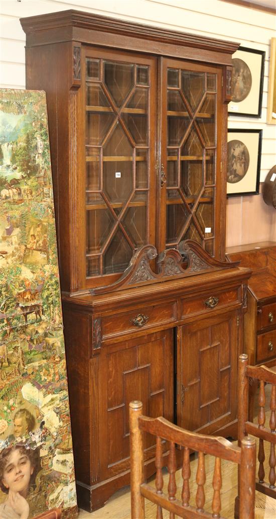 An Edwardian oak bookcase cabinet, H.122cm